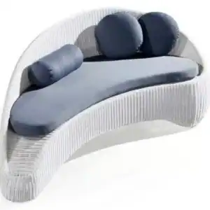 Modern hotel lobby sofa with upholstered cushions and curved design.